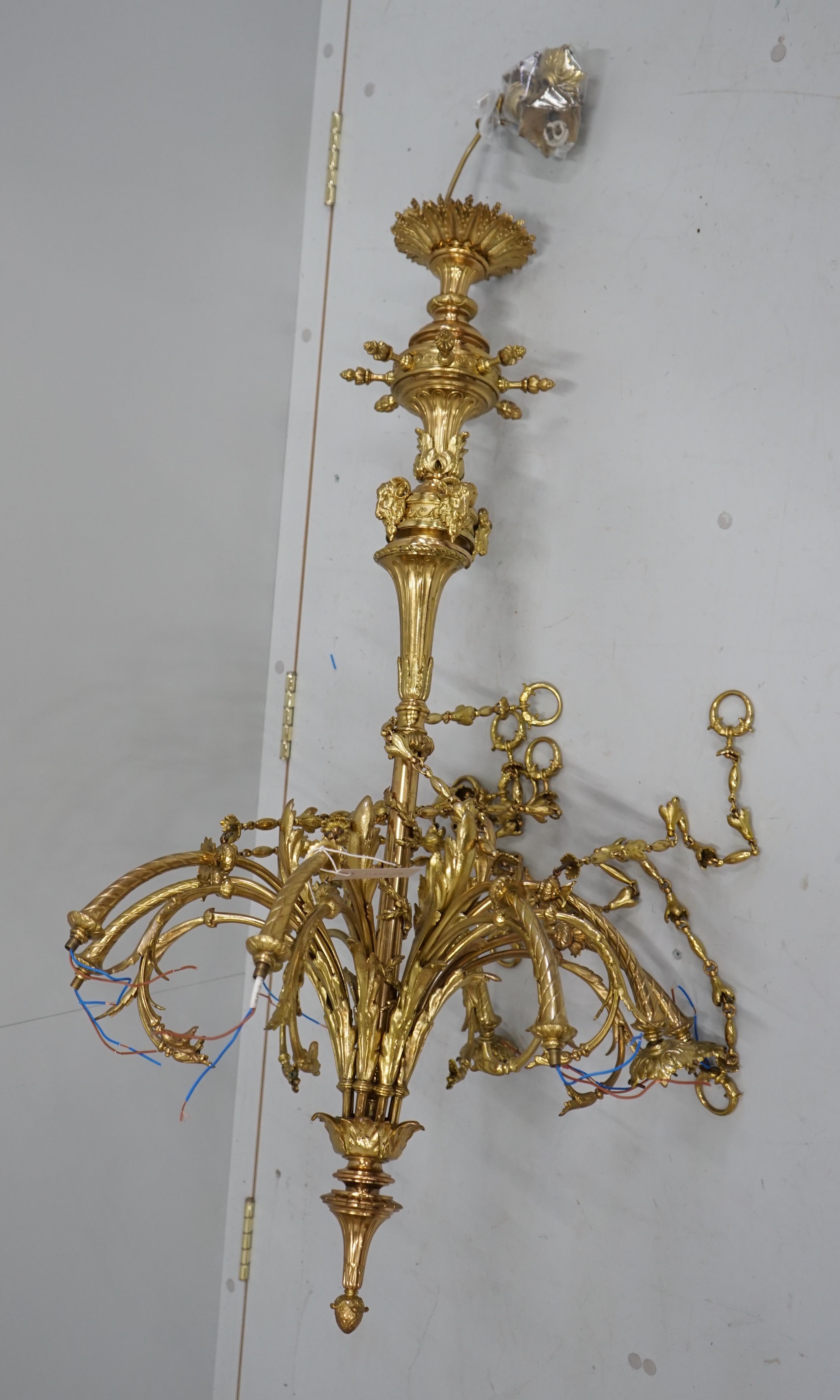 A gilt metal eight branch electrolier, height 106cm